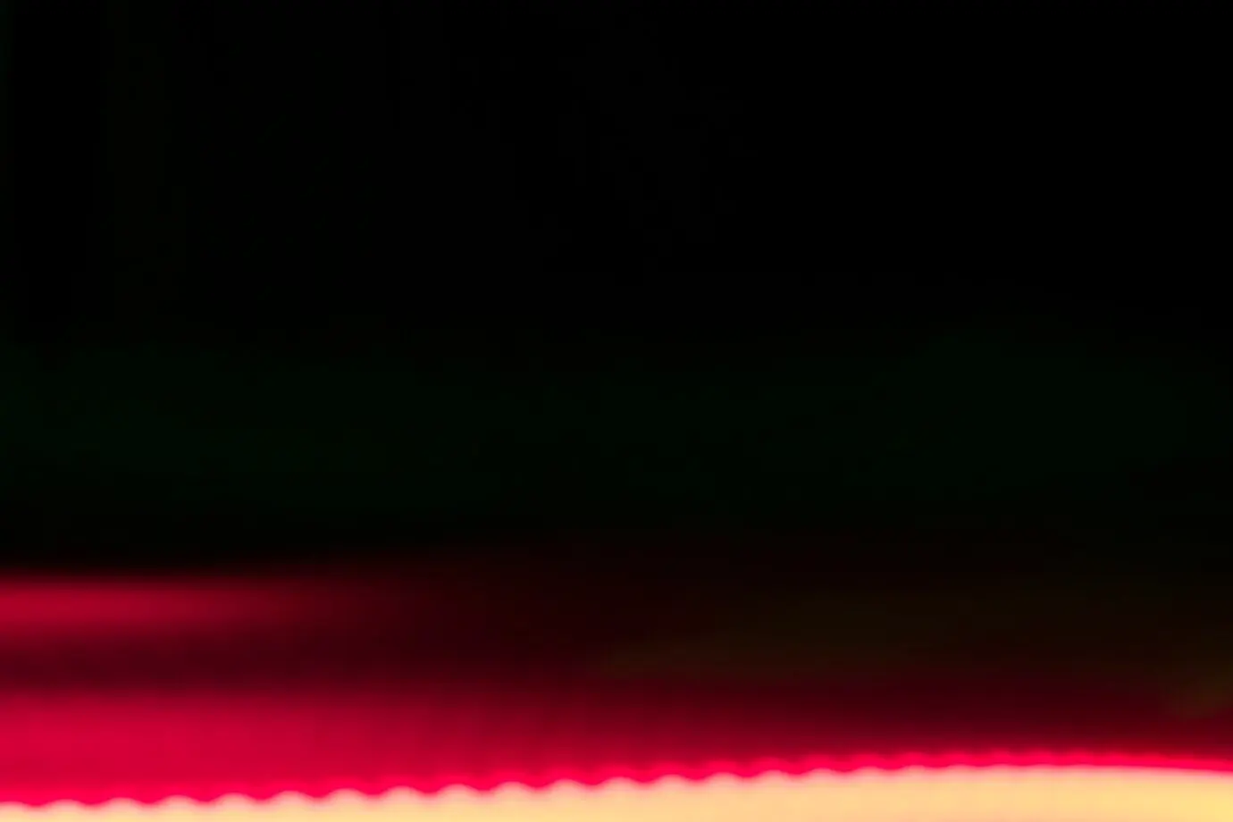 A bright light against a black background